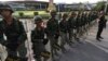 Thai soldiers stand in line blocking the entrance to the Army Club in Bangkok, Thailand, May 22, 2014. 