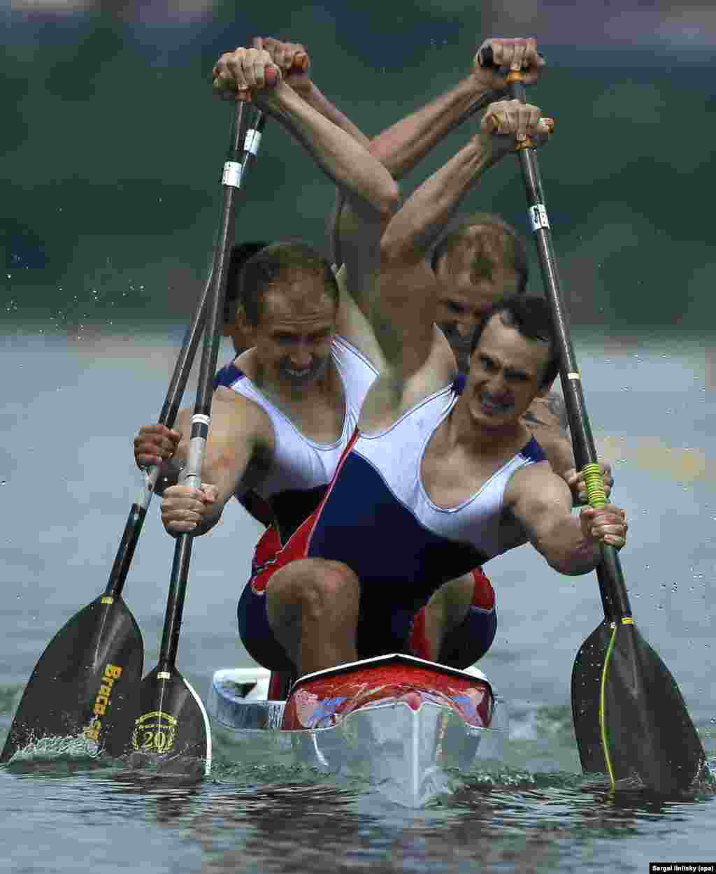 Gold medal winners Kirill Shamshurin, Viktor Melantyev, Rasul Ishmukhamedov and Vladislav Chebotar of Russia compete during the Men&#39;s C-4 1000m final race at the Canoe Sprint European Championships in Moscow, Russia, 25 June 2016.