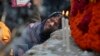 Bangladeshi relative of a victim cries in front of a monument erected in memory of the victims of Rana Plaza building collapse as they gather at the spot on its second anniversary in Savar, near Dhaka, Bangladesh, April 24, 2015.