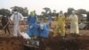 Volunteers and Congolese security officers dig in search for bodies of residents killed in an attack by suspected Islamist rebels at Masala, Democratic Republic of Congo, June 9, 2024. Authorities say the rebels struck again on June 13, killing at least 42 people.