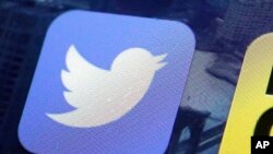 FILE - An icon for the Twitter app is seen on an iPhone screen in New York. 