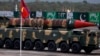 FILE - A Pakistani-made Shaheen-III missile, capable of carrying nuclear warheads, loaded on a trailer rolls down during a military parade to mark Pakistan's Republic Day in Islamabad, Pakistan, March 23, 2016. 