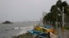 Small fishing boats are placed by the seawall as strong winds and slight rain brought by Typhoon Koppu hit Manila, Philippines, Oct. 18, 2015.