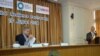 Ashvin Dayal, Associate VP and Asia Managing Director, The Rockefeller Foundation (left) looks over his notes as USAID Asia Regional Development Mission Director Michael Yates speaks at the launch of the Global Resilience Partnership, Aug. 19, 2014. (Stev