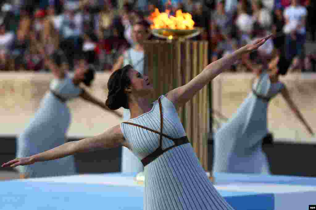 Actresses playing the role of Priestesses perform during the handover ceremony of the Olympic flame in the Panathenaic Stadium, where the first modern games were held in 1896, in Athens, Greece.