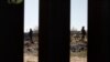 FILE - Mexican National Guard troops patrolling the country's northern border are seen from Sunland Park, New Mexico, Jan. 31, 2020.