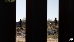 FILE - Mexican National Guard troops patrolling the country's northern border are seen from Sunland Park, New Mexico, Jan. 31, 2020.