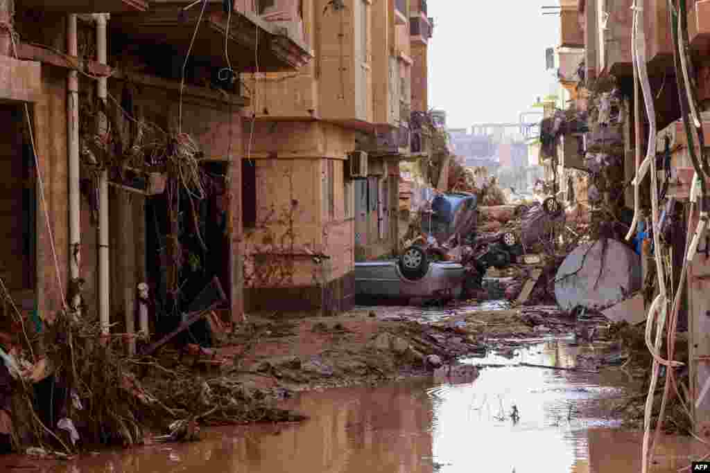 Overturned cars lay among other debris caused by flash floods in Derna, Libya, Sept. 11, 2023.&nbsp;Flash floods in eastern Libya killed more than 2,300 people in the Mediterranean coastal city of Derna alone, the emergency services of the Tripoli-based government said.