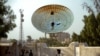 A satellite dish stands damaged after an attack on Egypt's main satellite station in the Maadi district of Cairo October 7, 2013.