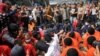 Migrants wait to be rescued as they drift in the Mediterranean Sea some 20 nautical miles north off the coast of Libya.