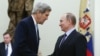 U.S. Secretary of State John Kerry (L) and Russia's Foreign Minister Sergei Lavrov shake hands during a joint news conference at the Kremlin in Moscow, Dec. 15, 2015. 