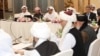 FILE - U.S., Taliban and Qatar officials during a meeting for peace talks in Doha, Qatar.