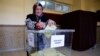 A woman casts her ballot at a polling station during a general election in Konya, Turkey, Nov. 1, 2015. 