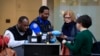 Transportation Security Administration workers screen airline passengers at Reagan Washington National Airport in Washington, Jan. 28, 2019, as federal workers and government contract workers return to work ending the record 35-day partial federal shutdow