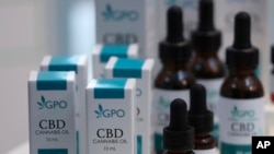 Bottles of extracted cannabis oil are displayed during a press conference at Thailand's Health Ministry in Bangkok, Thailand, Wednesday, Aug. 7, 2019. 
