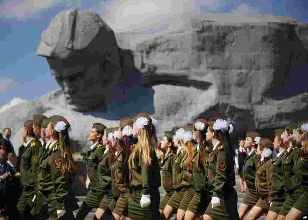 Belarusian cadets march past Brest Fortress monument during a Victory Day rally marking 71 years after the victory in WWII in the town of Brest, 360 kilometers (223 miles) southwest of Minsk, Belarus.