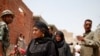 Voters check the registration lists on the second day of balloting. (Y. Weeks/VOA)