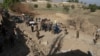 Security personnel arrive at the site of a truck bomb attack in Ghanikhil district, Nangarhar province, east of Kabul, Afghanistan, Oct. 3, 2020.