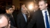 Iranian Foreign Minister Mohammad Javad Zarif (C) arrives at his hotel following his meeting with U.S. Secretary of State John Kerry and European Union foreign policy chief Catherine Ashton, in Geneva, Nov. 8, 2013.