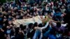 Kashmiri villagers carry body of Burhan Wani, chief of operations of Indian Kashmir's largest rebel group Hizbul Mujahideen, during his funeral procession in Tral, some 38 Kilometers (24 miles) south of Srinagar, Indian-controlled Kashmir, July 9, 2016.
