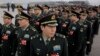 China Cuts Defense Spending as Economy Stumbles