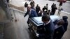 Pallbearers carry the casket of Quintonio LeGrier during his funeral in Chicago, Jan. 9, 2016. LeGrier was fatally shot by a Chicago police officer after allegedly swinging a baseball bat at him.