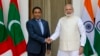 Indian Prime Minister Narendra Modi, right, shakes hands with Maldives' President Yameen Abdul Gayoom before a delegation level meeting in New Delhi, April 11, 2016. 