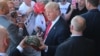 US Republican presidential candidate Donald Trump greets supporters at his campaign rally at Werner Enterprises Hangar in Omaha, Nebraska, May 6, 2016.