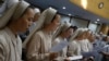 FILE - Catholic nuns attend mass at the Jesuit Apostolic Center in Seoul.
