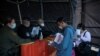 FILE - Roberto, 37, from Honduras, has his family's court dates changed by Customs and Border Protection after court cancellations amid the coronavirus disease (COVID-19) outbreak in Ciudad Juarez, Mexico, April 20, 2020.