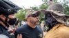 Two protesters at a protest against mandates to wear masks amid the coronavirus outbreak, Austin, Texas, June 28, 2020. 