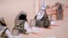 In this pool photo of a sketch by courtroom artist Janet Hamlin and reviewed by the U.S. Department of Defense, three of the five Sept. 11 defendants, from left, Ramzi Binalshibh, Walid bin Attash and the self-proclaimed terrorist mastermind Khalid Sheikh Mohammed, attend a hearing at the Guantanamo Bay U.S. Naval Base in Cuba, Jan. 28, 2013.