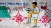 FILE - A mural depicting a soccer player is seen on a wall of a stadium in the Hodan district of Mogadishu, Somalia, June 13, 2017. 