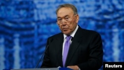 FILE - Kazakh President Nursultan Nazarbayev delivers a speech during a session of the St. Petersburg International Economic Forum 2016 in St. Petersburg, Russia, June 17, 2016. 