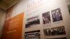 FILE - A display board showing photos of criminals receiving their death sentences by Chinese's courts on display at the China Court Museum in Beijing, Apr. 11, 2017.