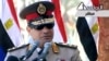 In this image taken from Egypt State TV, Egyptian army chief Abdel Fattah el-Sissi delivers a speech in Cairo, July 24, 2013. 