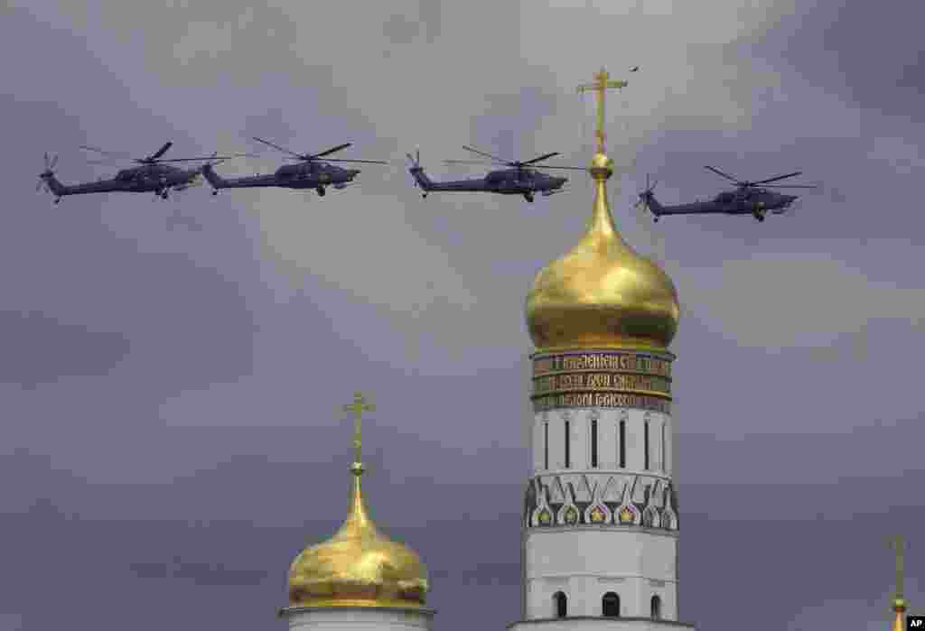 Russian military helicopters fly over Ivan the Great bell-tower and Moscow's Kremlin during a general rehearsal for the Victory Day military parade which will take place at Moscow's Red Square on May 9 to celebrate 71 years after the victory in WWII in Moscow, Russia,