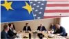 Combo photograph EU and US flags, meeting of the Serbia and Kosovo delegations