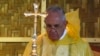 Pope Francis, in a rain poncho,during a Mass near Tacloban airport, The Philippines, Jan. 17, 2015.
