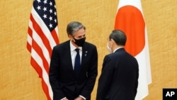 Japanese Prime Minister Yoshihide Suga, right, meets with U.S. Secretary of State Antony Blinken, left, during a courtesy call at the prime minister's official residence Tuesday, March 16, 2021. Defense and foreign ministers from the U.S. and Japan…