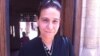 Coptic Christian Amal Beshara wears a picture of her husband, killed in a church bombing in Alexandria. Cairo, Egypt. May 29 2012. (E. Arrott/VOA)