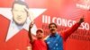 FILE - Venezuela's President Nicolas Maduro, right, embraces retired General Hugo Carvajal as they attend the Socialist party congress in Caracas, July 27, 2014. 