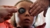 FILE - A girl's eyes are examined March 8, 2012.