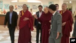 Tibetan spiritual leader, the Dalai Lama, center, leaves Max Hospital, in New Delhi, India, April 12, 2019. 