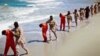 This undated image made from video released by Islamic State militants in April 2015 purports to show a group of captured Ethiopian Christians taken to a beach before being executed.