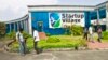 FILE - Employees stand outside the Start-up Village in Kinfra High Tech Park in the southern Indian city of Kochi.