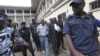 Laurent Akoun, center, a top FPI official, after his trial at a court in Abidjan, August 31, 2012.