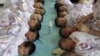 FILE - Newly born babies receive vaccines at a hospital in Aksu, Xinjiang Uighur Autonomous Region.