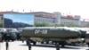 Military vehicles carry DF-5B intercontinental ballistic missiles during a parade commemorating the 70th anniversary of Japan's surrender during World War II held in front of Tiananmen Gate in Beijing, Sept. 3, 2015.