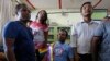 Gay rights activists watch a news channel covering the Supreme court's decision on gay sex in Mumbai, India, Feb. 2, 2016. 